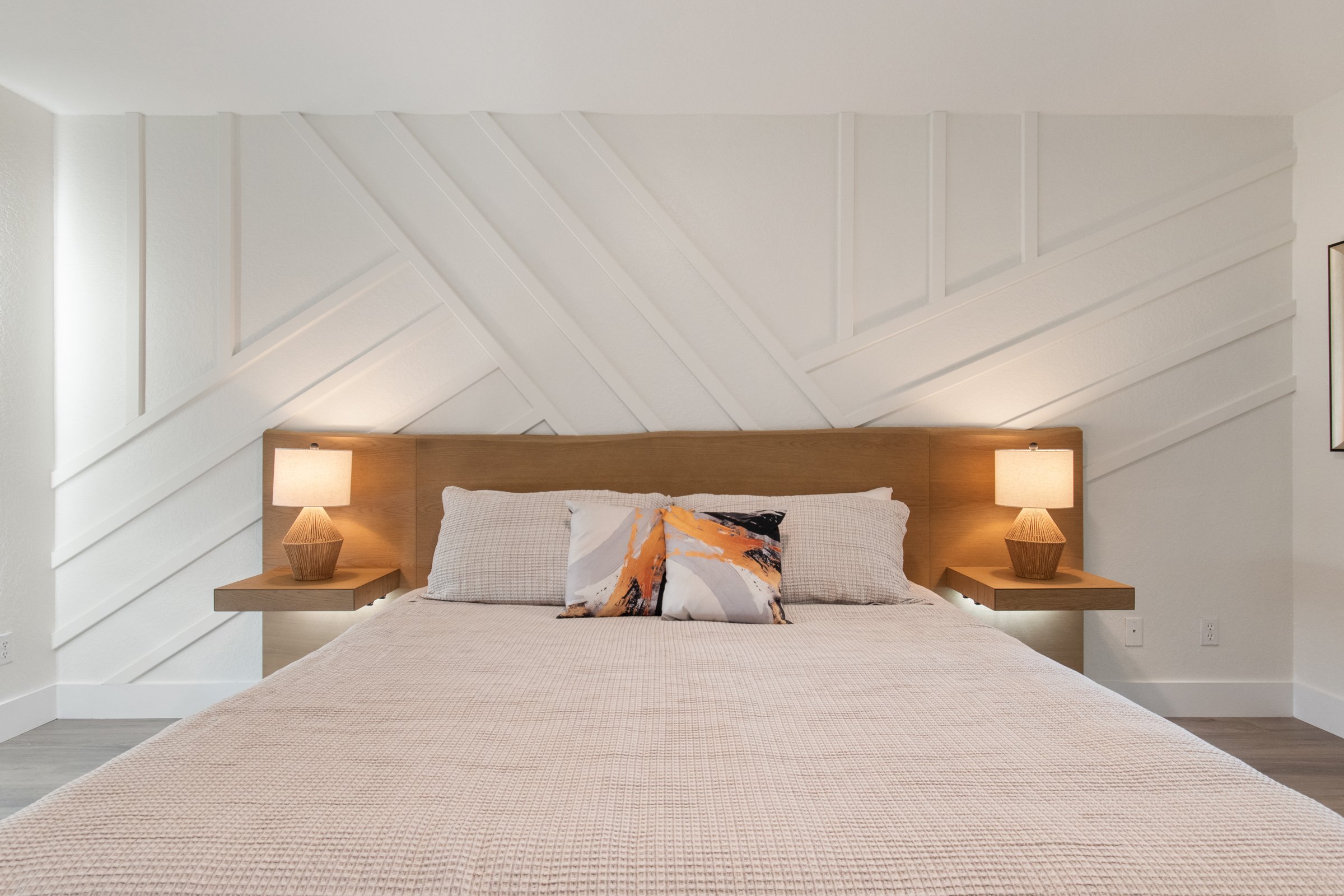 King-sized bed with premium linens and blackout shades