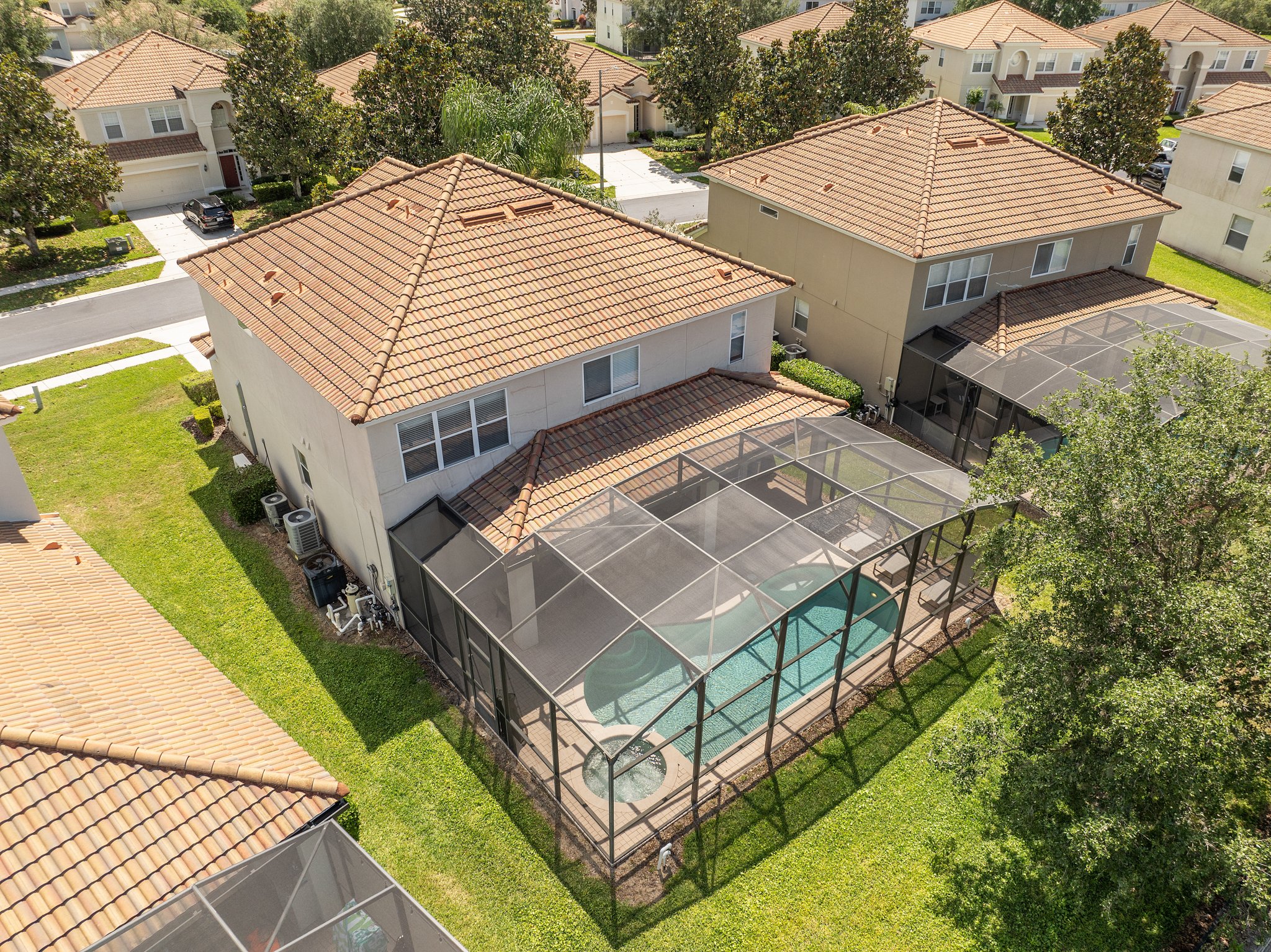 Pool and home from the hilltop edge