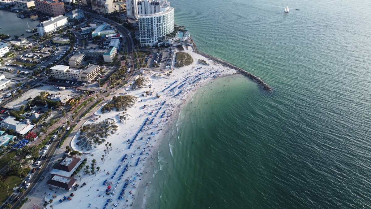 Aerial view of Clearwater Beach white sand, beach umbrellas, and Gulf of Mexico waterfront