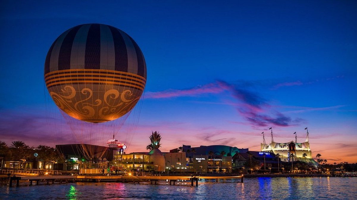 Disney Springs Aerophile balloon and Cirque du Soleil tent at sunset over Lake Buena Vista
