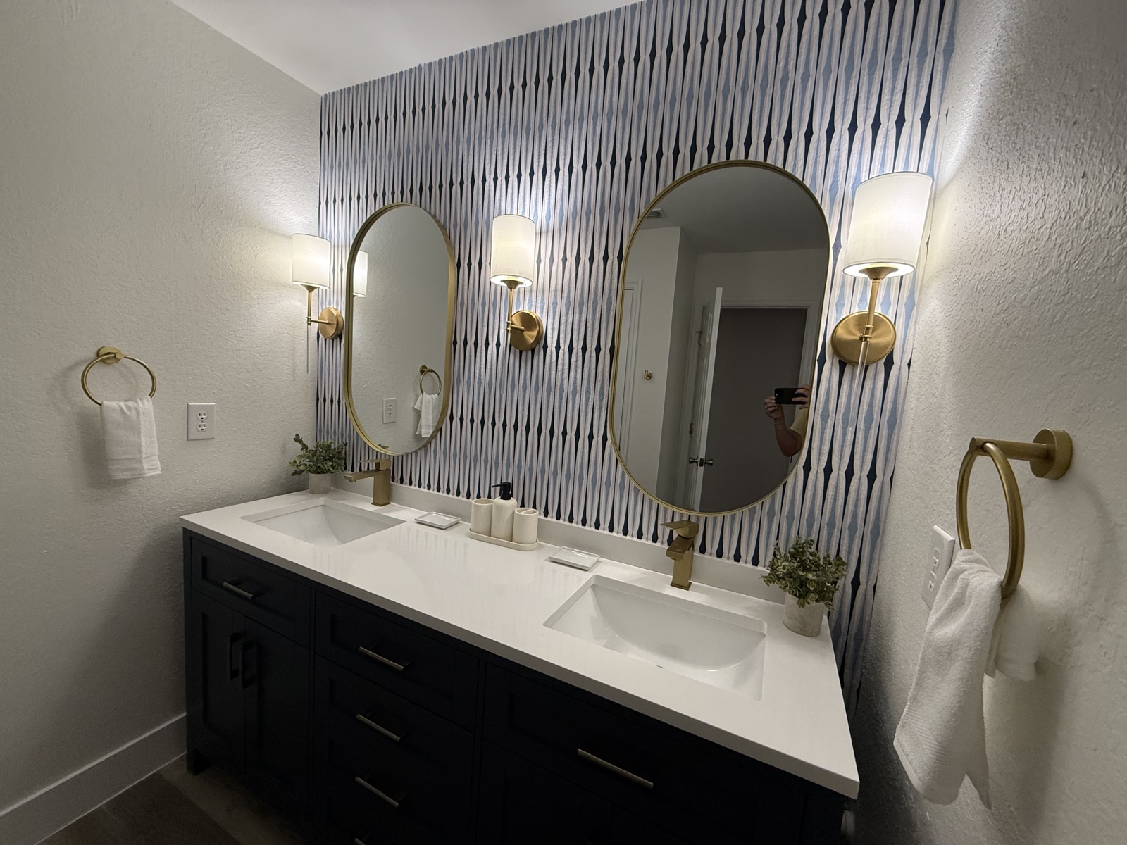 Double-sink bathroom vanity with striped wallpaper at Time-Out Corner, Lakeside