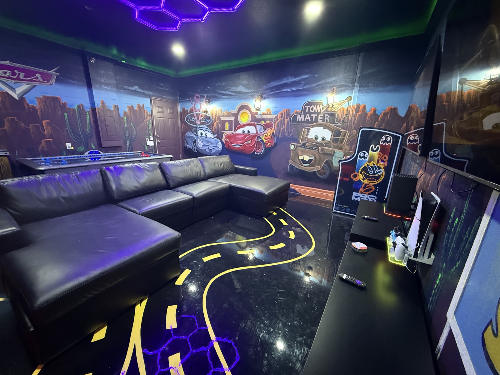 Sectional lounge and Route 66 floor in the Radiator Springs game room
