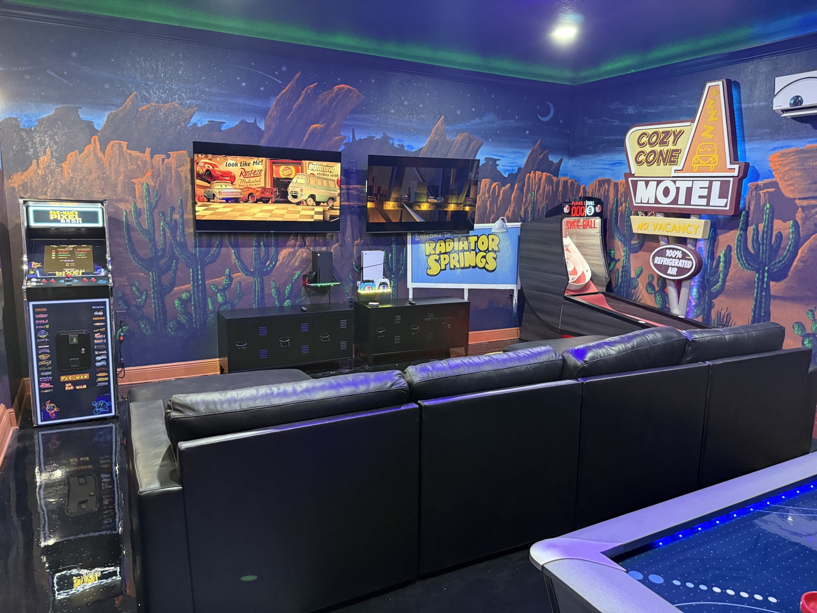 Radiator Springs game room with Pac-Man arcade, skee-ball, air hockey, and dual TVs at Time-Out Corner, Lakeside