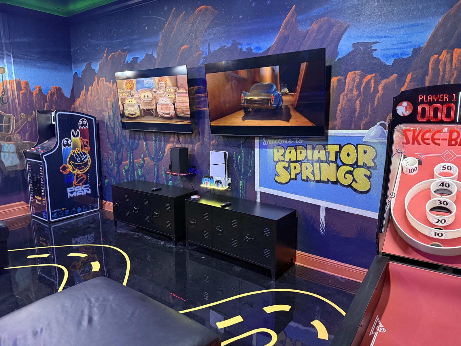 Radiator Springs mural, arcade, and skee-ball in the Lakeside game room
