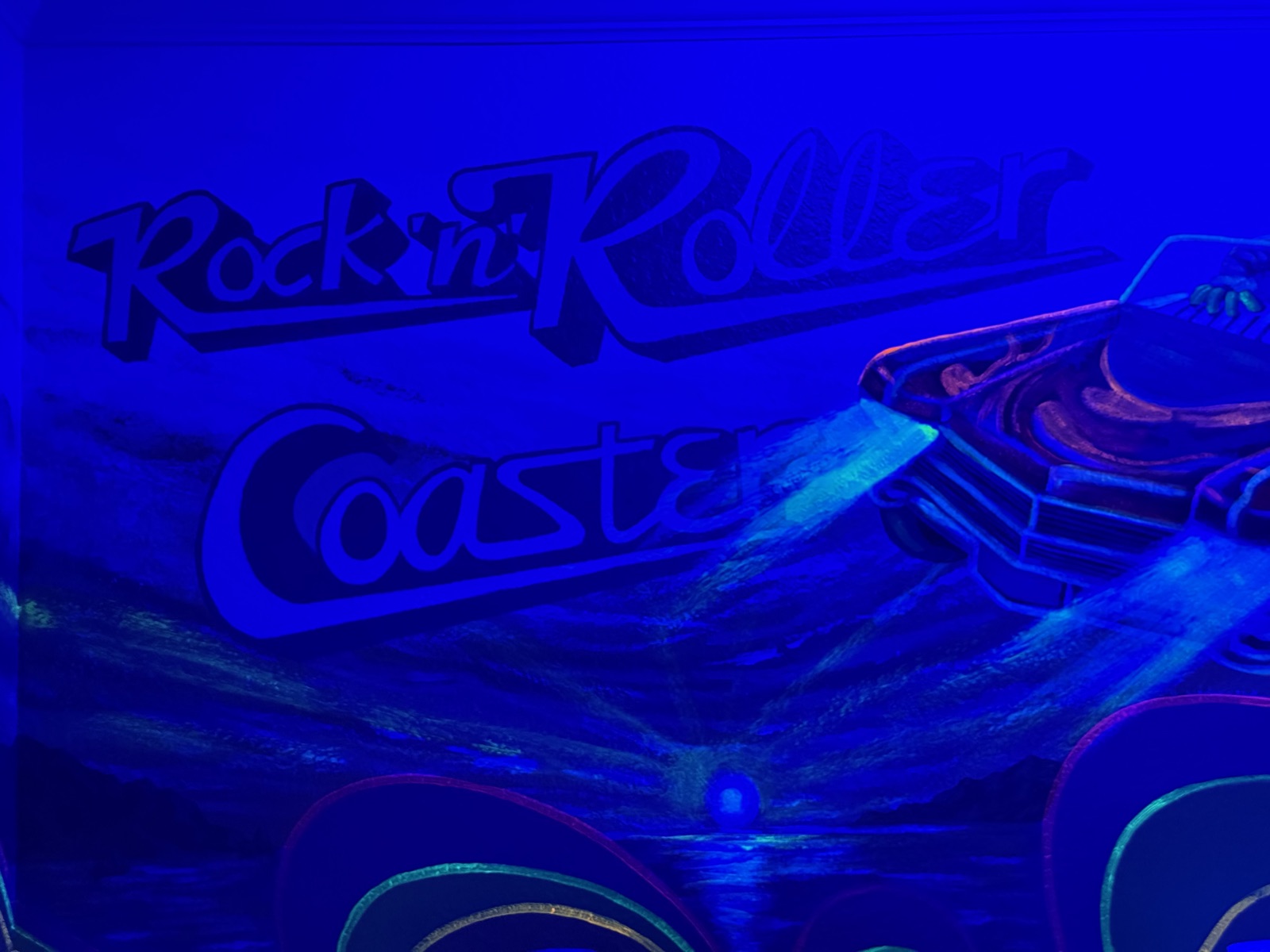 Glowing Muppets' Rock 'n' Roller Coaster mural under blacklight at Time-Out Corner, Lakeside