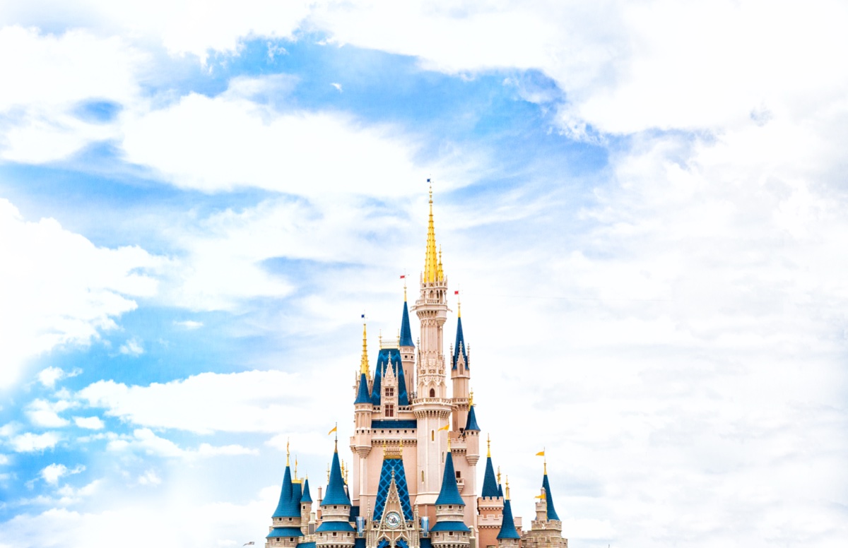 Cinderella Castle at Magic Kingdom against a blue sky with white clouds