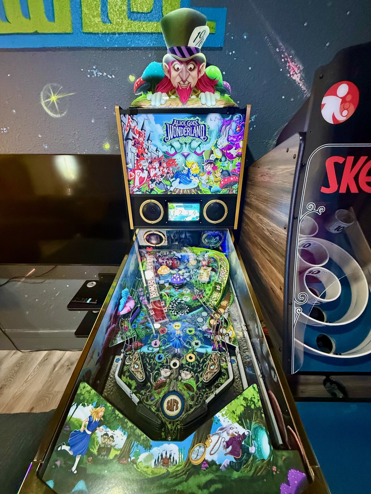 Pinball machine playfield closeup in the Pizza Planet game room