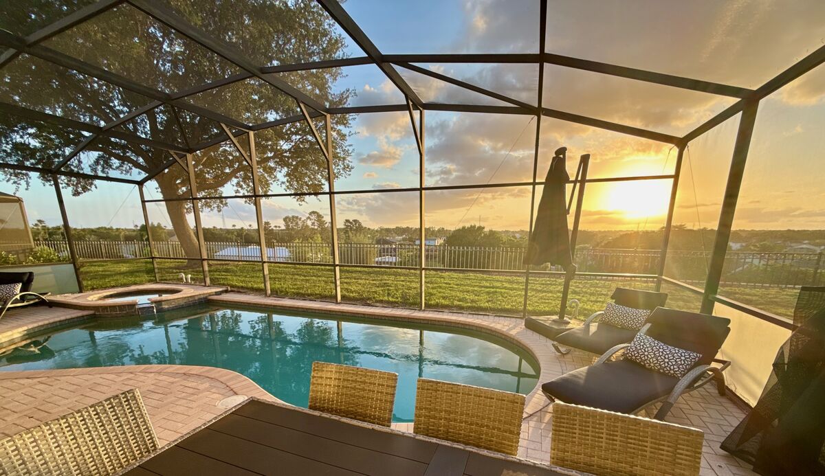 Sunset over the outdoor dining table on the lanai