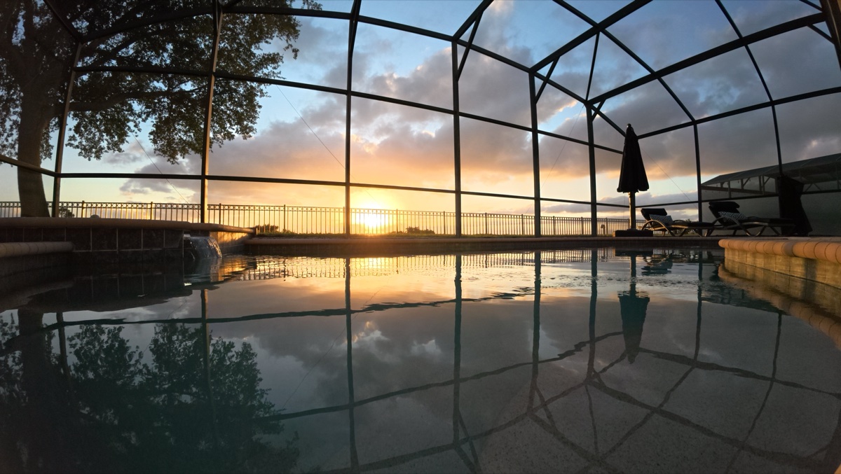Sunset reflected on the pool surface at water level
