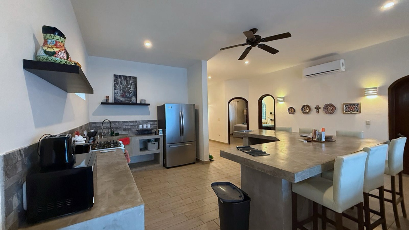 Fully equipped kitchen with concrete island at Rincón del Descanso, Isla Mujeres