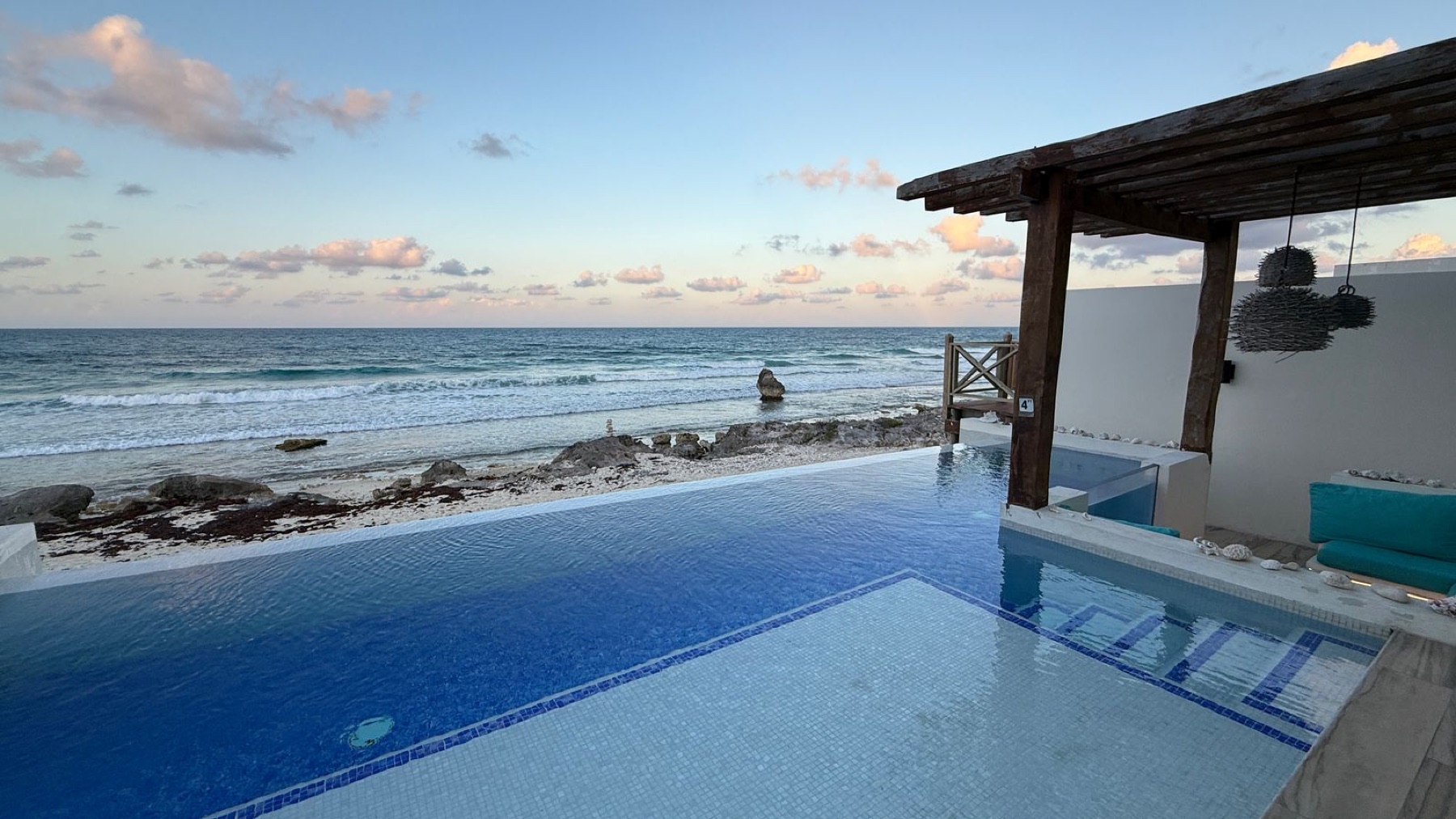 Infinity pool overlooking the Caribbean Sea at Rincón del Descanso vacation rental Isla Mujeres Mexico