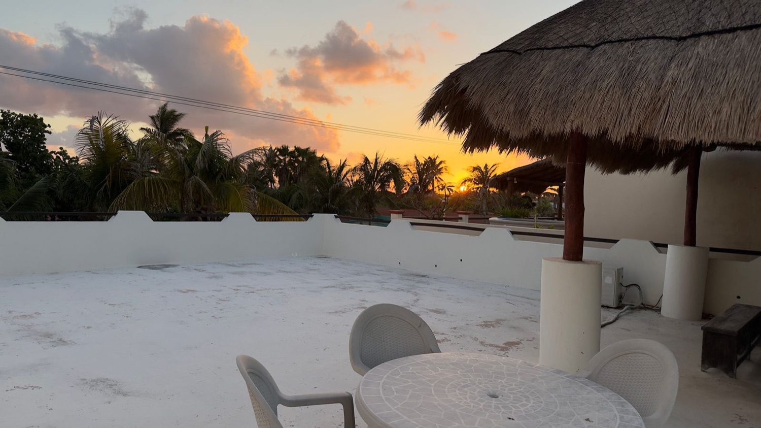Rooftop palapa dining area with sunset views at Rincón del Descanso vacation home