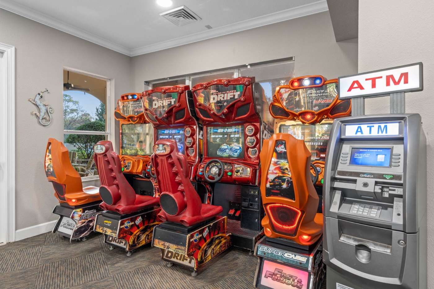 Arcade with racing and video games in the Windsor Hills clubhouse
