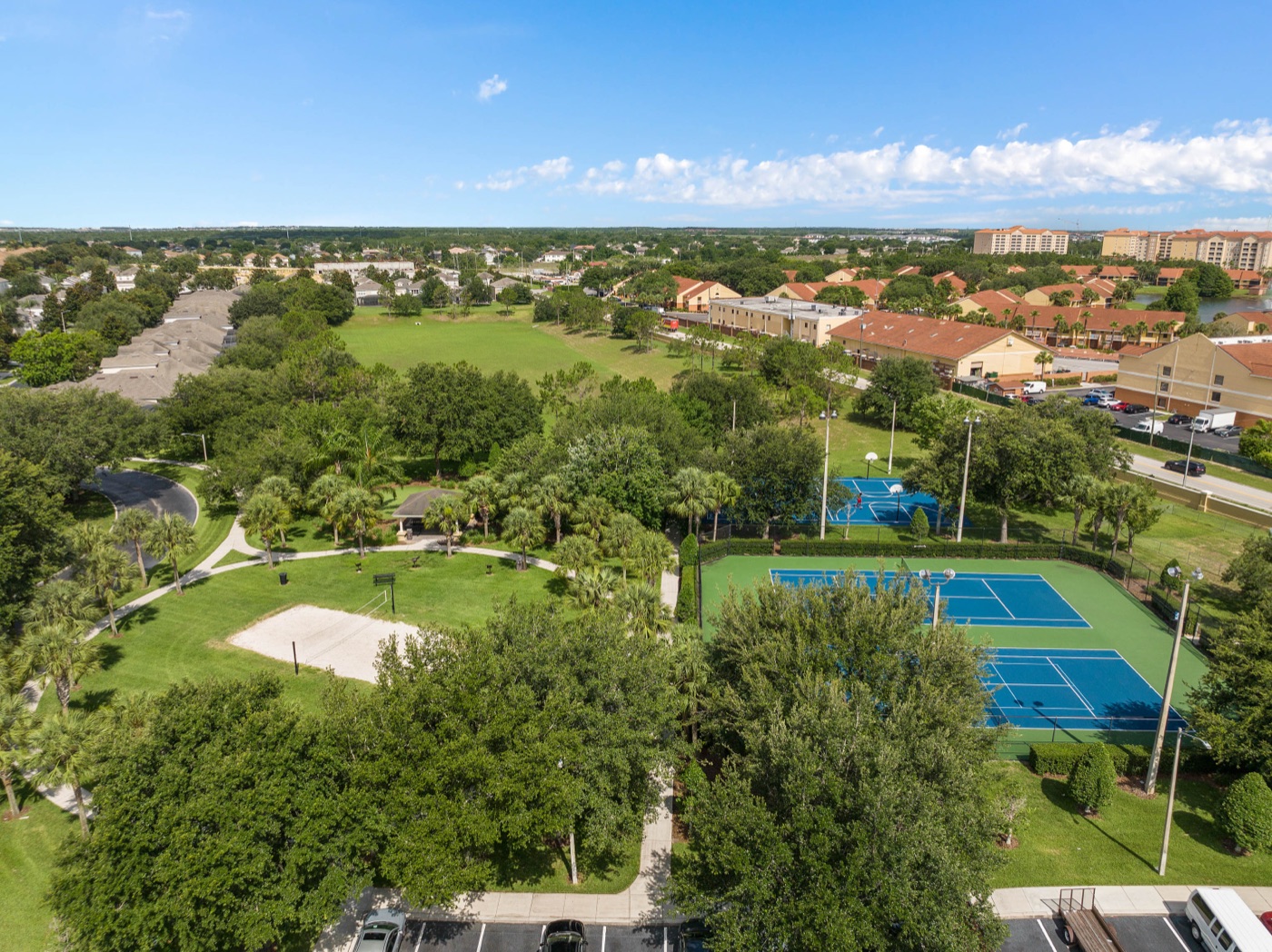 Open grass sports field surrounded by trees at Windsor Hills Resort